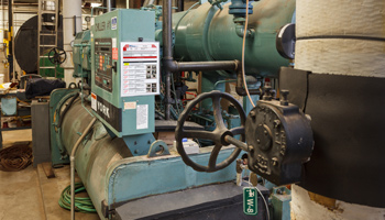 A lockout tagout procedure diagram posted on heavy machinery for workplace safety.