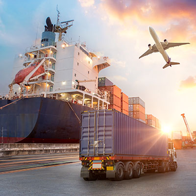 A cargo ship, a truck, and a plane.